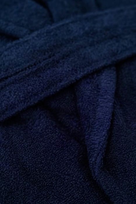 Mėlyno unisex chalato fortinio fragmentas